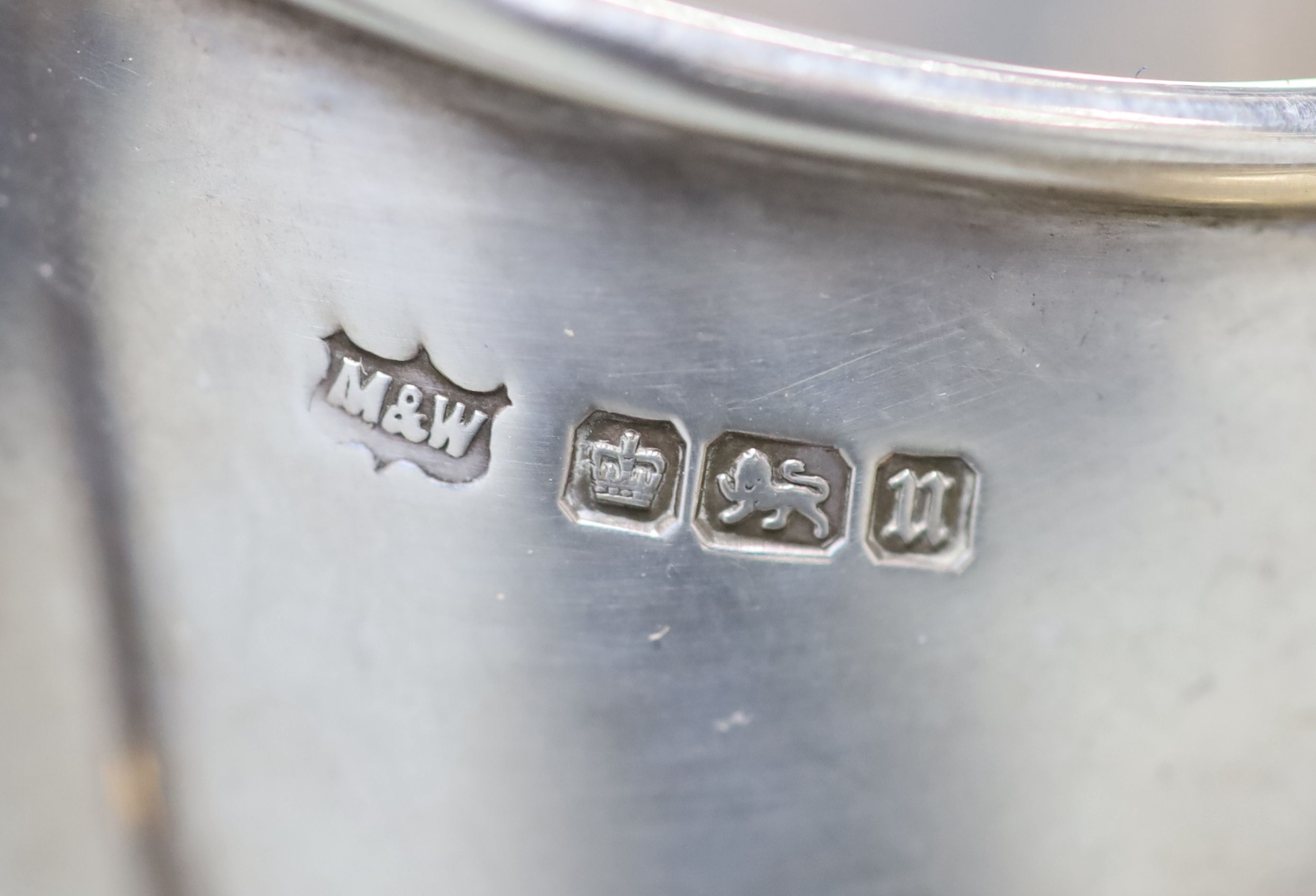 A George V demi fluted silver four piece tea and coffee service, Mappin & Webb, Sheffield, 1912, a matched plated hot water pot and two small 925 dishes